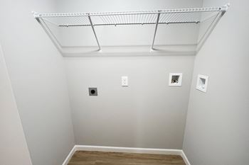 A room with white walls and a ceiling with pictures on it